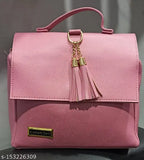 Hot pink faux leather shoulder bag with gold chain tassels