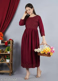Maroon kameez with short sleeves and hemline, paired with a matching dupatta draped over shoulder