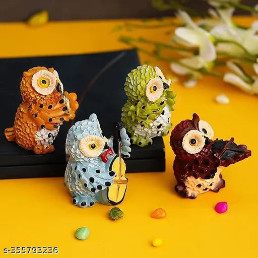 Colorful, ornate ceramic owl set of 4 playing instruments as decorative home showpiece. Handcrafted with intricate details