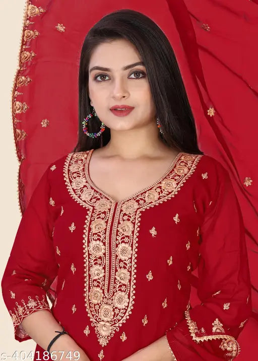 Red embroidered kameez with sharara bottoms and dupatta