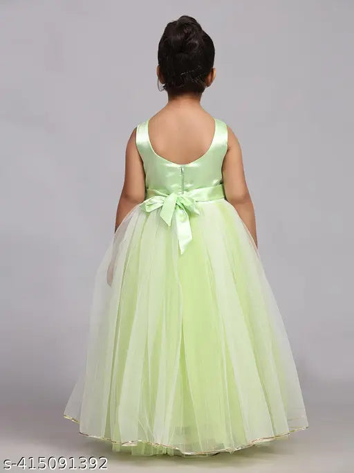 Green full-length kids party dress with a parrot print