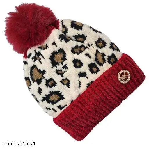 Black and white leopard print knit cap with red pompom ball top