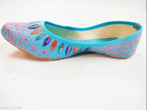Sky blue synthetic mojaris with embellished pattern, closed back, comfortable fit. These Indian jutis are a wardrobe must-have for sizes IND-4 to IND-9