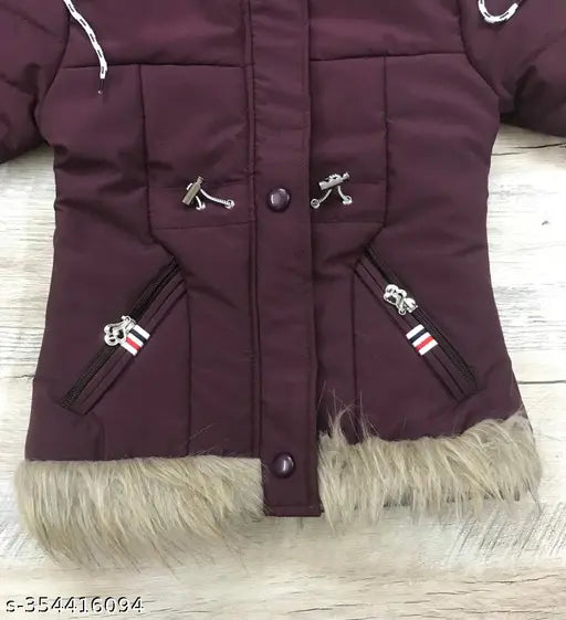 The image shows a purple coat with faux fur trim and buttons on the front. It appears to be made of wool fabric and is designed in a puffer style with several pockets
