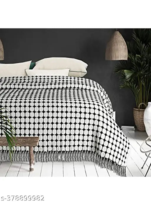 Cotton throw bedcover in black and white with geometric design