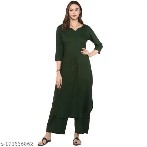Green rayon kurta set for women, featuring palazzos and three-quarter sleeves. Solid green color, Indian origin." (108 characters)