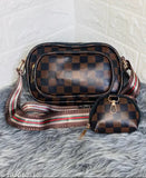 Multi-colored canvas sling bag with striped straps and two compartments, possibly a designer brand