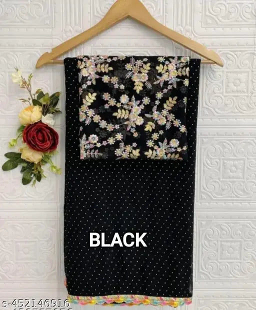 Black and gold floral print diamond scarf with white border, hanging on wall