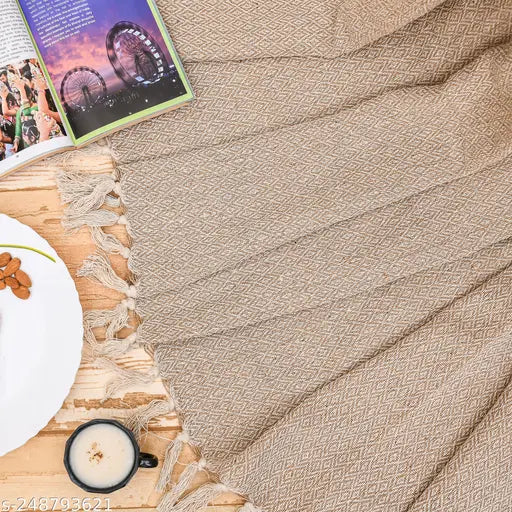 Beige plush throw blanket, soft texture, great interior decoration
