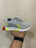 Grey and green knit sneaker with non-slip sole for sports activities, suitable for both boys and girls