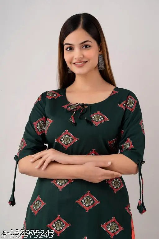 DarkGreen Rayon printed kurta & palazzos set, latest design by Zeenat Libaas. Stylish three-quarter sleeve Indian kurta outfit