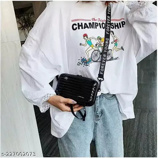 Black sling bag with long straps for hands-free carrying