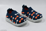 Blue and orange baby shoes with white soles