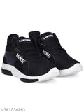 Black and white boys running shoes with Nike swoosh symbol