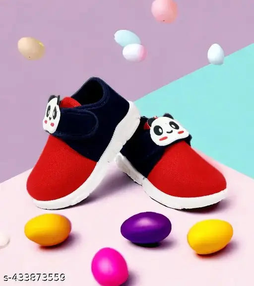 Red and black cartoon character sneakers for young children, with blue soles, white trim, velcro closures