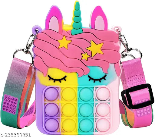 Pastel-colored unicorn purse with a clear bubble front, designed with rainbow patterns and featuring a pop bag on top. It's a shoulder crossbody bag with a plush unicorn design, and it comes in a pack of one