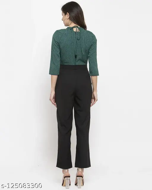 Women's green and black houndstooth print crepe jumpsuit with three-quarter sleeves, depicts a stylish halter neck on a mannequin