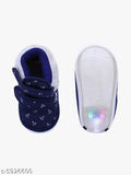 Navy blue canvas baby booties with PVC sole, printed design, slip-on fastening for comfortable fit. Perfect for infants aged 6-24 months