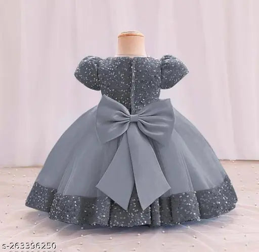 Embellished net jasmine frock with super diamond mono cotton lining, perfect for kids' parties. Sleeve length: sleeveless. Sizes: 12-18 Months to 6-7 Years. Indian origin