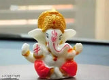 Orange poly resin Ganesh idol for car dashboard, popular Hindu deity figure on display
