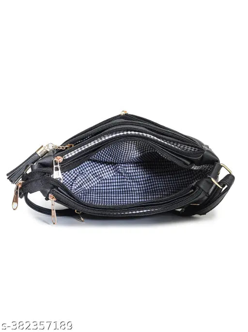 Glossy black sling bag with multiple compartments and zip closures, suitable for women or girls
