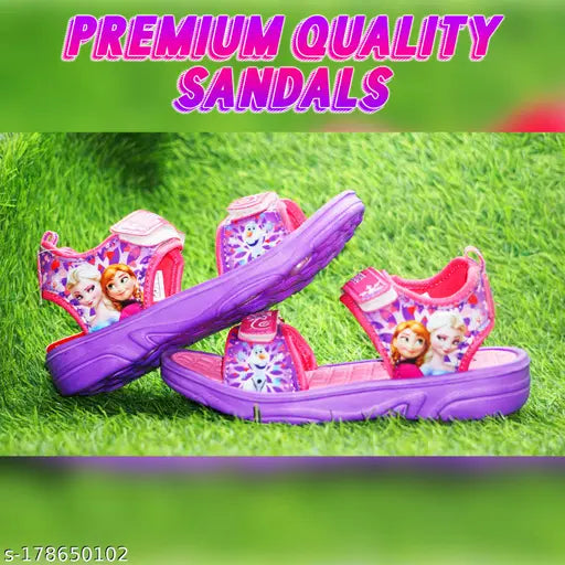 Disney Frozen Elsa and Anna together sandals for children. Purple, pink and green design featuring Elsa's face on strap, comfortable footbed, adjustable velcro straps, summer fashion accessories