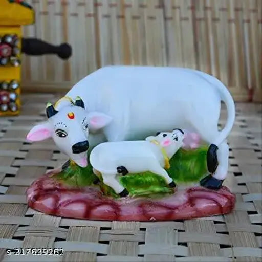 Poly resin Kamdhenu cow and calf statue, traditional Indian home decor with a height of 10cm and length of 12cm