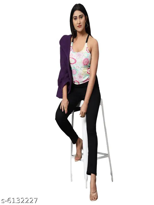 Solid black denim skinny fit jeggings with high waist and elastic closer for women, on model