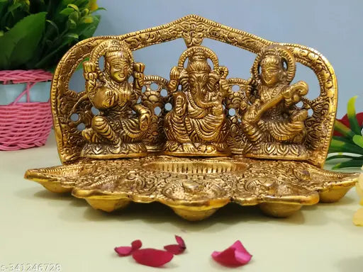 Metal Laxmi Ganesh Saraswati idol set for pooja and gift, traditional Indian deity figures on decorative stand