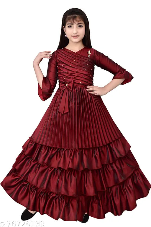 Maroon silk frock dress for girls, embellished net pattern, three-quarter sleeves. Quality Indian-made garment suitable for 7-8 years (bust 28 in, length 36 in). Girls' gown dresses, affordable and comfortable. #GOWNDRESSESFORGIRLS #barbie #looklikebarbie #SUMBULFASHION #princessdresses