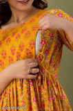 Woman in rayon maternity feeding gown with two side zip, three-quarter sleeves, printed Anarkali pattern, size M