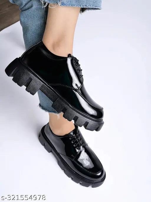 Black patent leather loafers for women, detailed lace-up design in classic style, wide fit - made in India