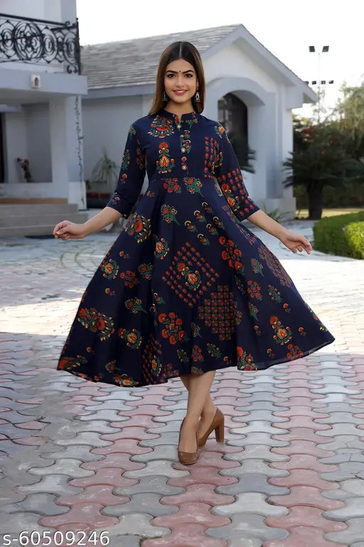 Blue cotton Anarkali gown with floral print by SARD Girls, featuring three-quarter sleeves and full stitching. Authentic Indian attire for women