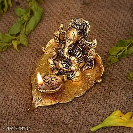 Metal Ganesh ji on leaf with Diya Idol, intricately detailed home décor sculpture, 12cm x 8cm x 8cm, Indian origin