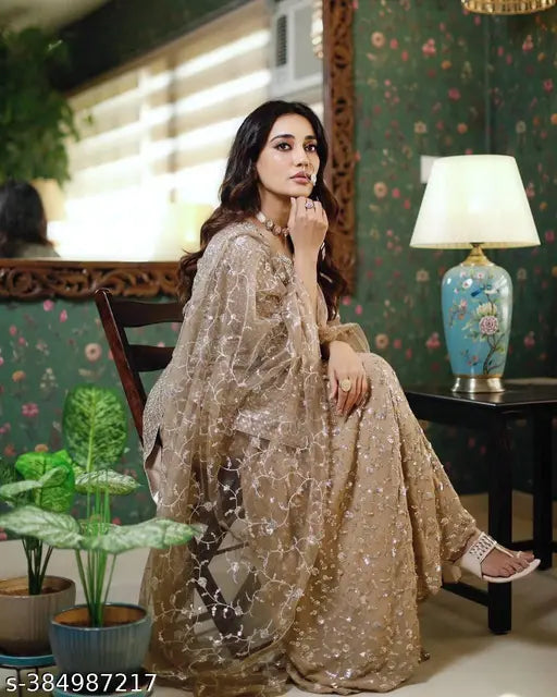 Gold sequined dupatta set with flared bottoms and sheer sleeves