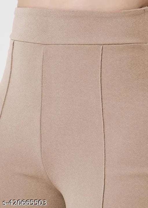 High-waisted brown bell bottom trousers, zip closure