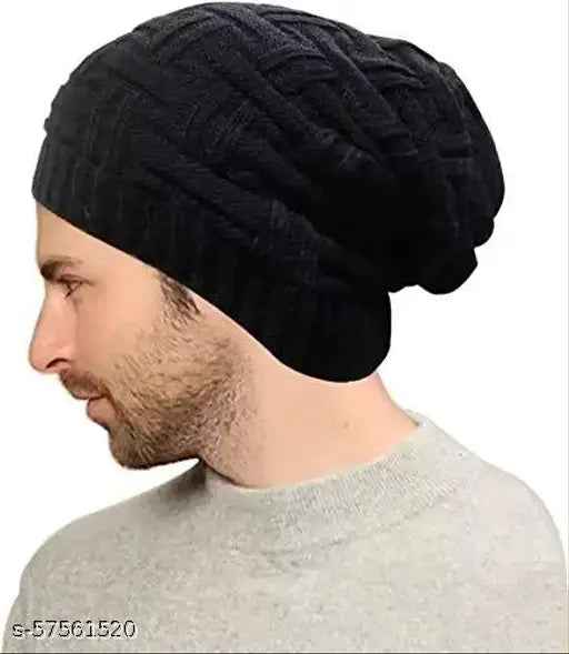Black woolen beanie hat by Sulbha, featuring thermal spun acrylic knit and fur lining for extra warmth. Ideal for outdoor activities like skiing, snowboarding, camping, hiking, and winter holidays. Perfect for everyday wear with a unique wrinkled design that suits most outfits. Hand wash only. Made in India