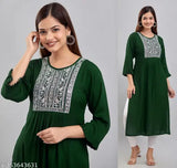 Dark green rayon embroidered kurti with three-quarter sleeves, ideal for festivals and parties. Women's casual and designer wear." (82 characters)