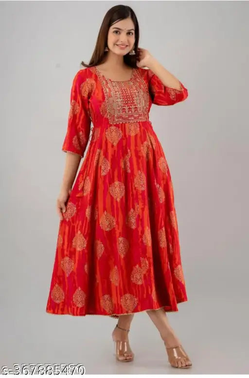 Long, traditional, embroidered Anarkali kameez with red base color and multiple intricate designs in gold