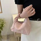 Peach and silver Gukas dumpling sling bag for women. Handbag features a detachable belt strap for versatile wear options, ideal for casual party styles