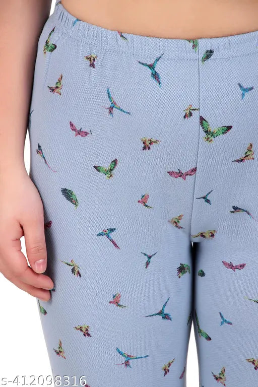 Trendy solid blue leggings with bird pattern