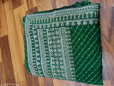 Green and beige embroidered saree with fringe ends