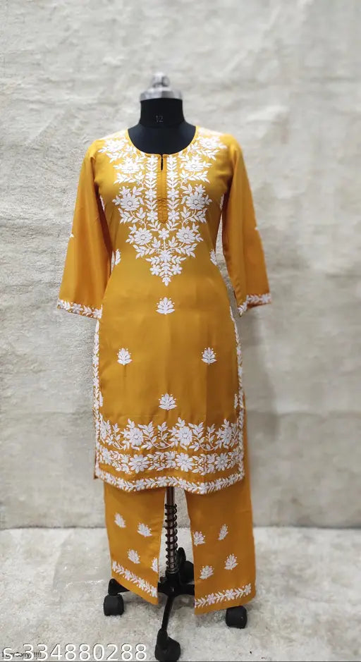 Rayon Chikankari embroidered straight calf length kurta and plazo with floral details, features three-quarter sleeves, round neck. India made size M (Bust 38in), L (Bust 40in), XL (Bust 42in), XXL (Bust 44in, Shoulder 16in, Waist 40in, Length 44in), XXXL (Bust 46in), 4XL (Bust 48in), available in various sizes