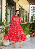Red rayon anarkali kurta with floral print, embellished with embroidery. Floral print long dress for women, A-line shape, three-quarter sleeves, round neck. New design, under $500. Jaipuri print kurti from India