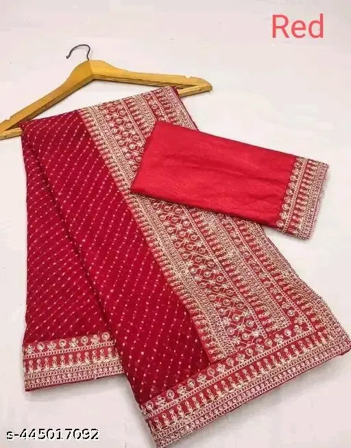 Red saree with pallu, embellished border, and matching blouse