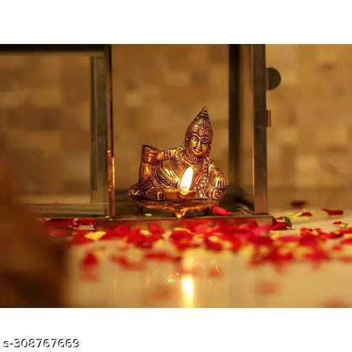 Metal Kuber statue with oil lamp