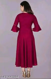 Maroon long-sleeved dress with ruffled details and flared bottom