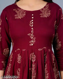 Stylish rayon long gold print kurti with embroidered pattern, perfect for ethnic wear. Three-quarter sleeves in sizes S (36in bust, 46in length), M (38in bust, 42in length), L (40in bust, 42in length), XXXL (46in bust, 42in length). Made in India