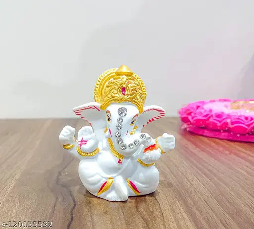 Handcrafted white gold polyresin Ganesh idol statue, 8cm tall. Modern, spiritual home decor with detailed craftsmanship from Kunti Craft. Ideal for cars, homes, and offices. Made in India