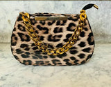 The image displays a fashionable side bag with an animal print design